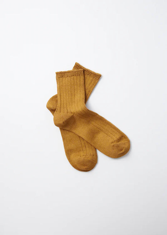 Flat shot of Rototo Cotton Linen Ribbed Ankle Socks - Deep Gold