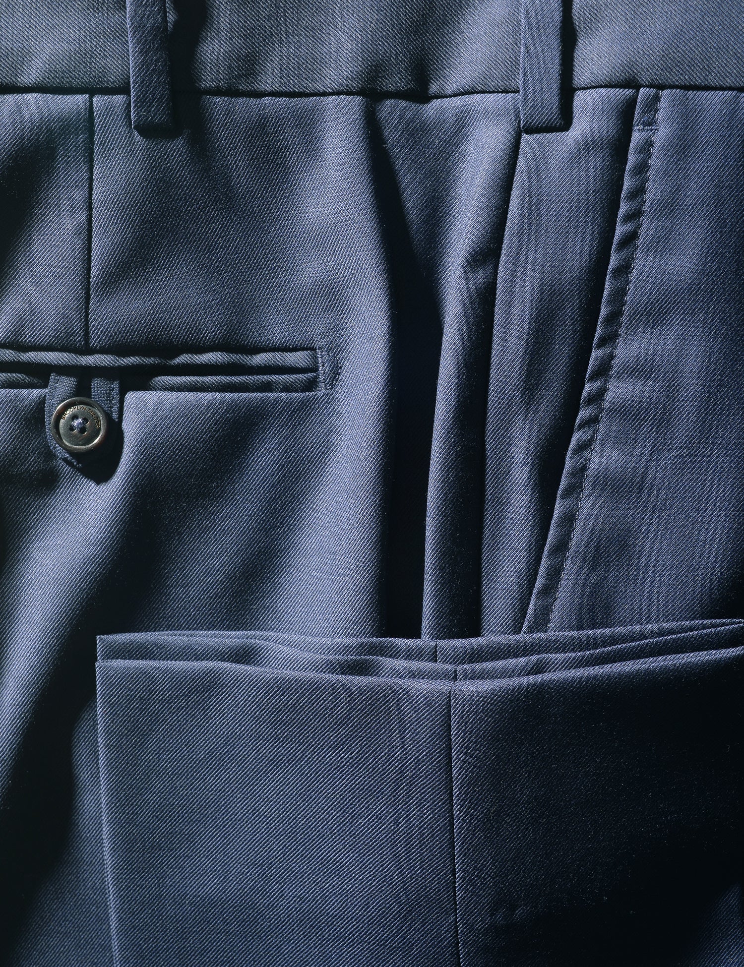 Detail shot of Brooklyn Tailors BKT50 Tailored Trouser in Super 120s Twill - Bright Navy showing back pocket, side pocket, and cuff