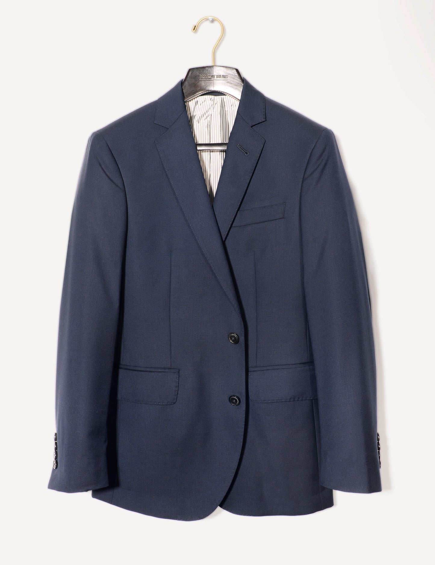 Full length shot of 2020 Version BKT50 Tailored Jacket in Super 110s Plainweave - Classic Navy on a hanger