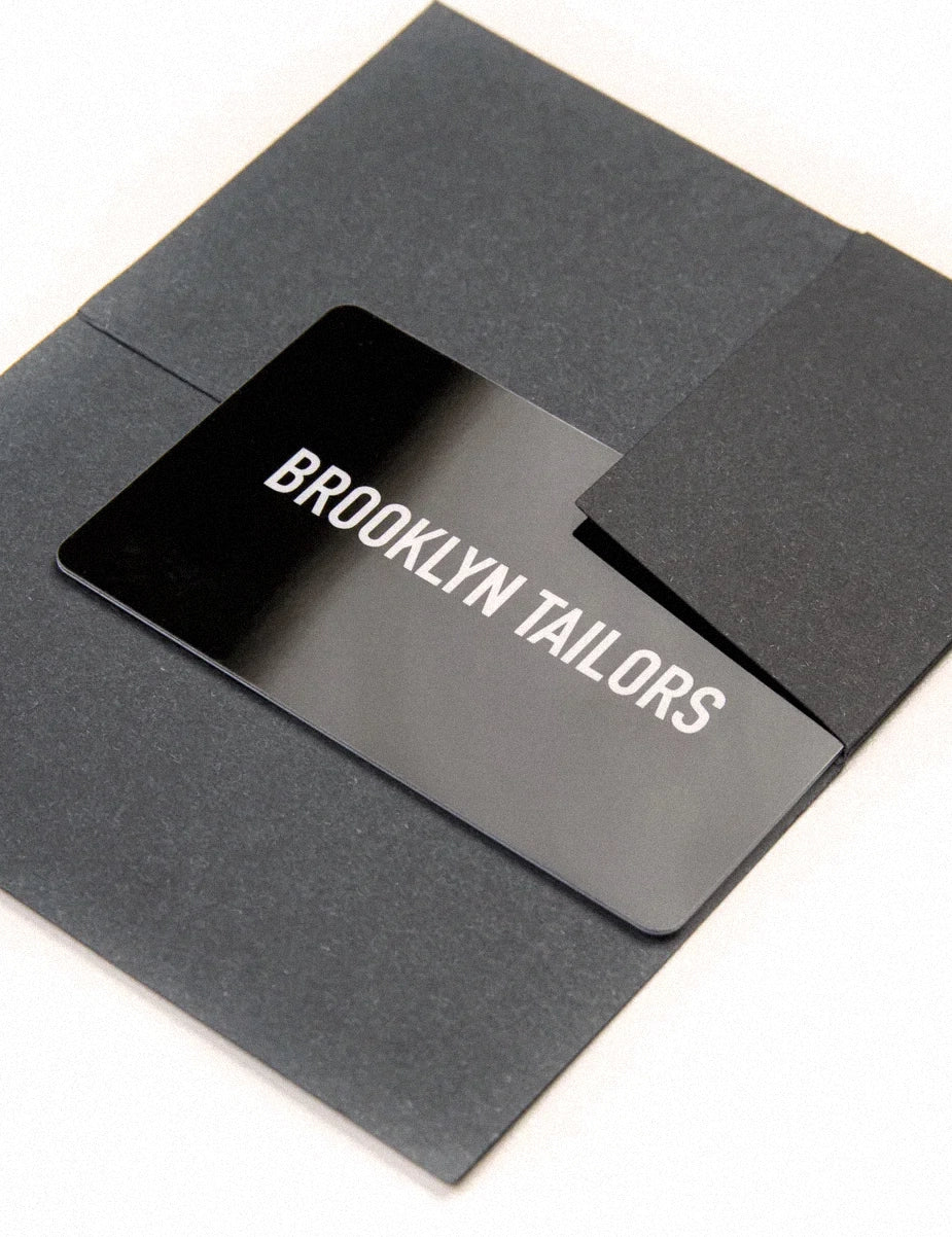 Photo of Brooklyn Tailors Gift Card sitting on an envelope