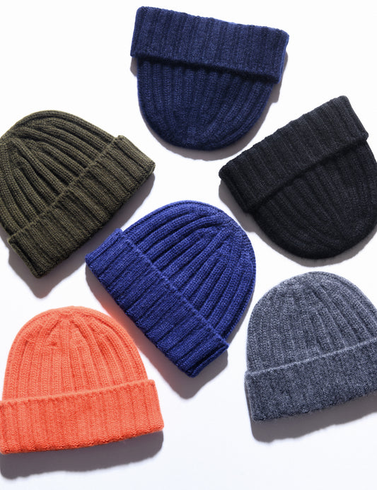 Photo of several colors of Cableami cashmere beanies