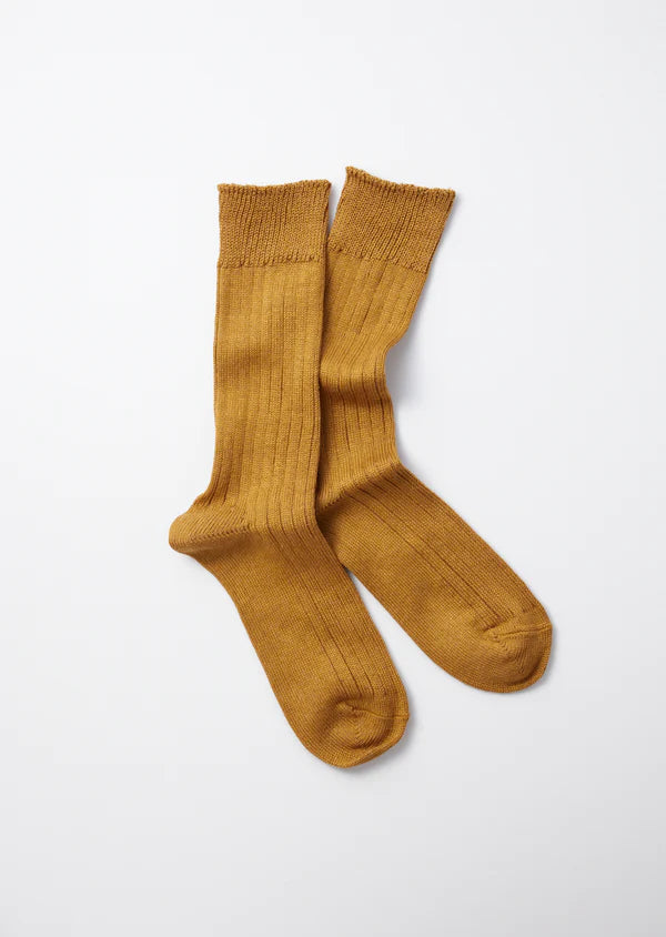 Flat shot of Rototo Cotton Linen Ribbed Crew Socks - Deep Gold