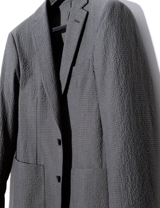 Detail of front of Brooklyn Tailors BKT35 Unstructured Jacket in Crinkled Wool & Cotton - Storm showing fabric texture