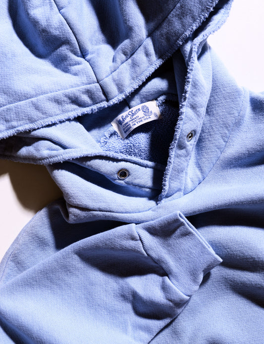 Detail of Velva Sheen New Hoodie Sweatshirt in Foggy Blue showing hood, frayed edge, and label