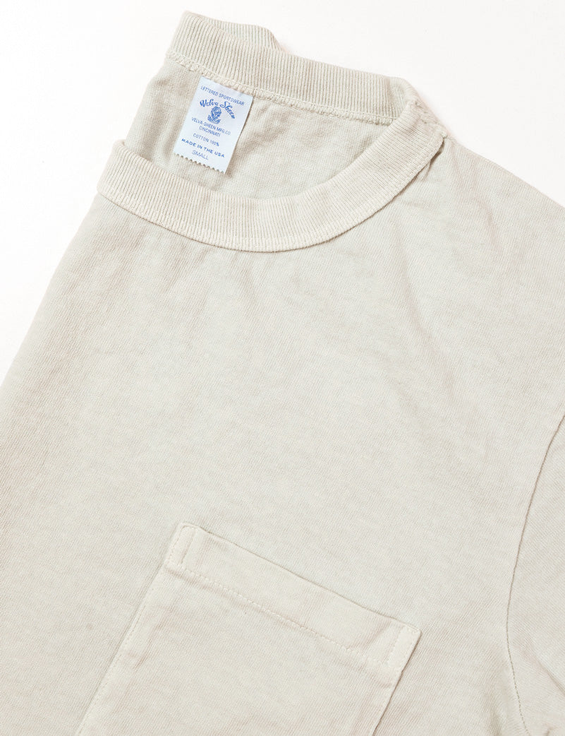 Detail of Pigment Pocket Tee in Light Gray showing collar and pocket