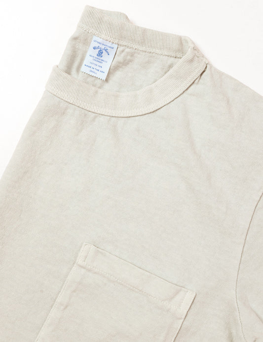 Detail of Pigment Pocket Tee in Light Gray showing collar and pocket