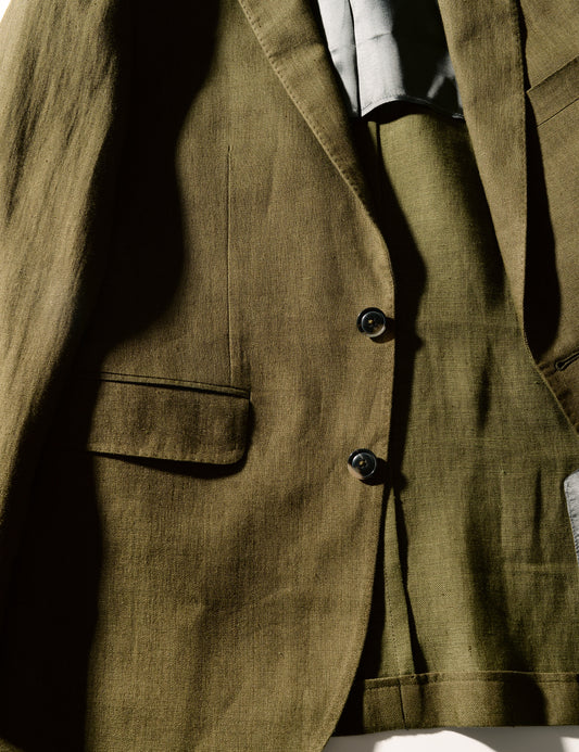 Detail shot of Brooklyn Tailors BKT50 Tailored Jacket in Linen Twill - Moss showing buttons, hip pocket and half-lining