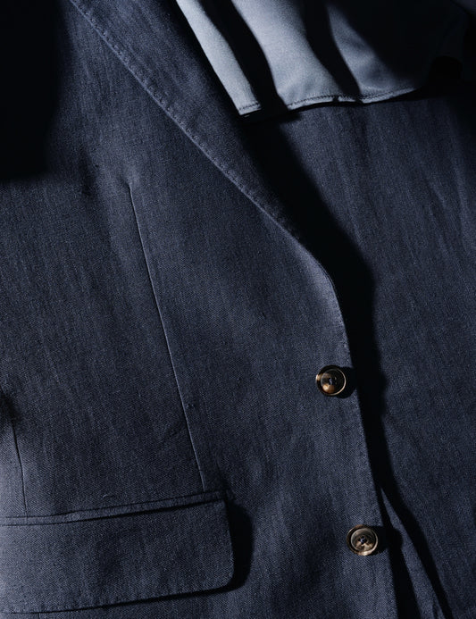 Detail shot of Brooklyn Tailors BKT50 Tailored Jacket in Linen Twill - Salerno Blue showing hip pocket, buttons, and fabric texture