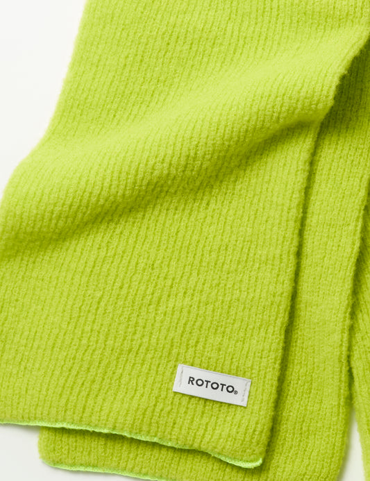 Detail of Merino Boucle Scarf - Lime showing texture and label
