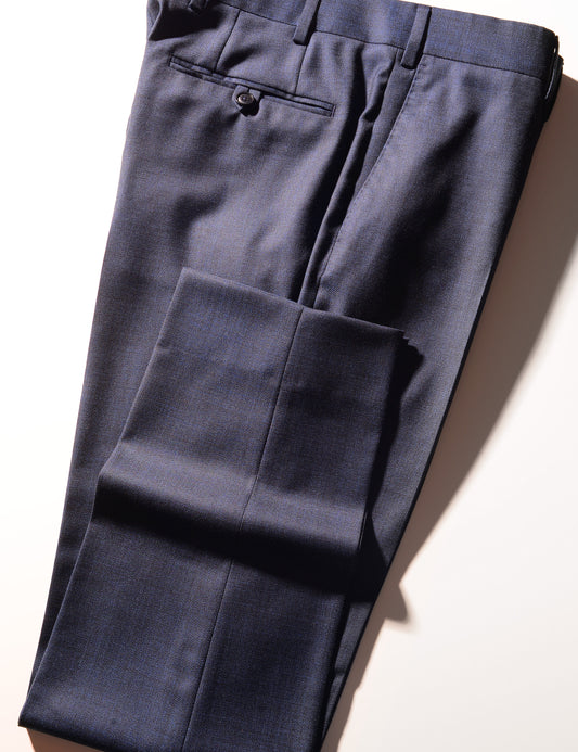 Detail shot of BKT50 Tailored Trousers in Textured Wool - Deep Sea showing back pocket, side pocket, and hem