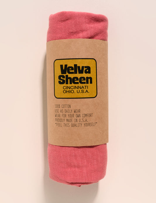 Image of Velva Sheen Crewneck T-Shirt in Radiant Red rolled in a paper sleeve