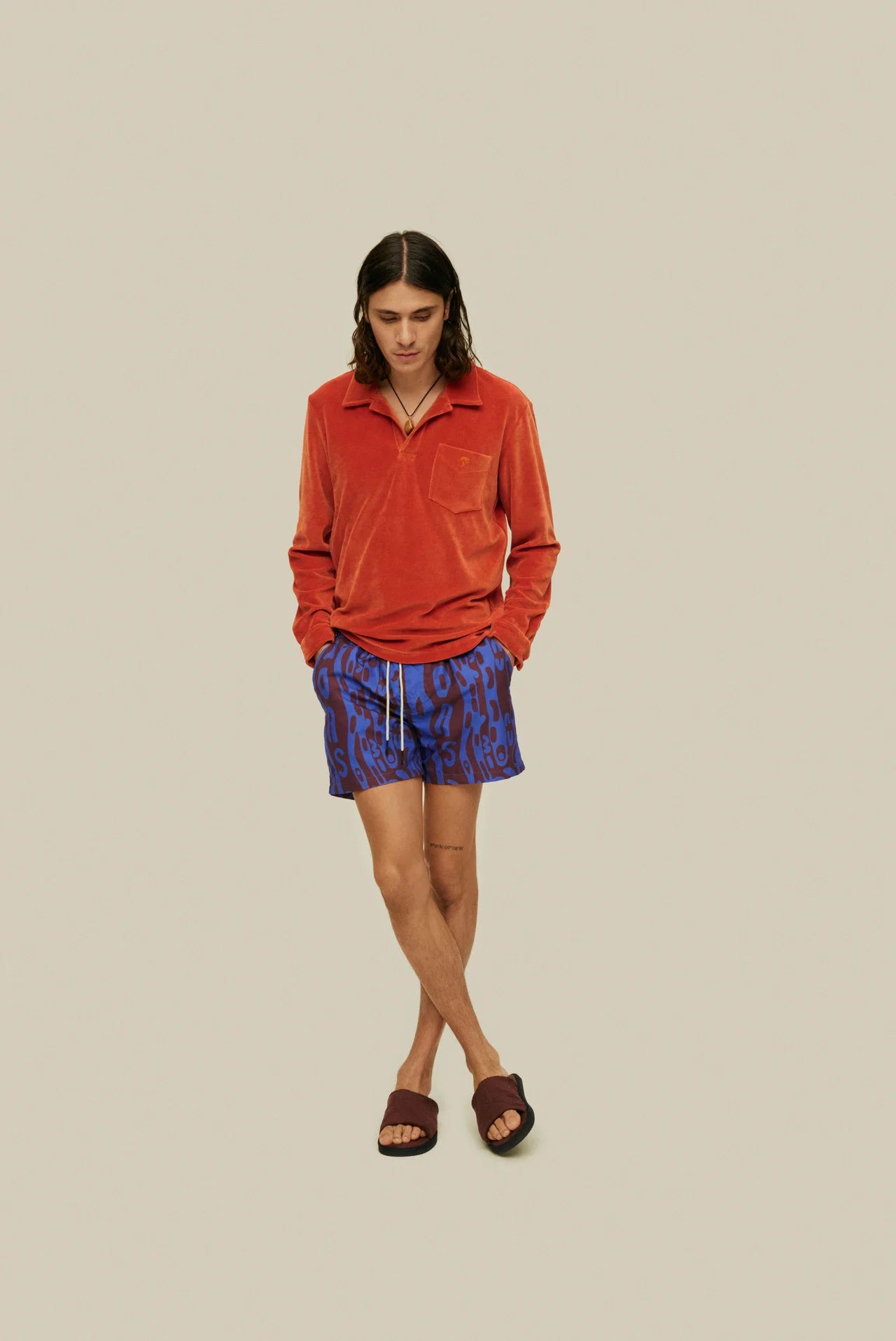 OAS Thenards Jiggle Swim Shorts on model. Model is wearing swim shorts with orange terry shirt. Taken from front.