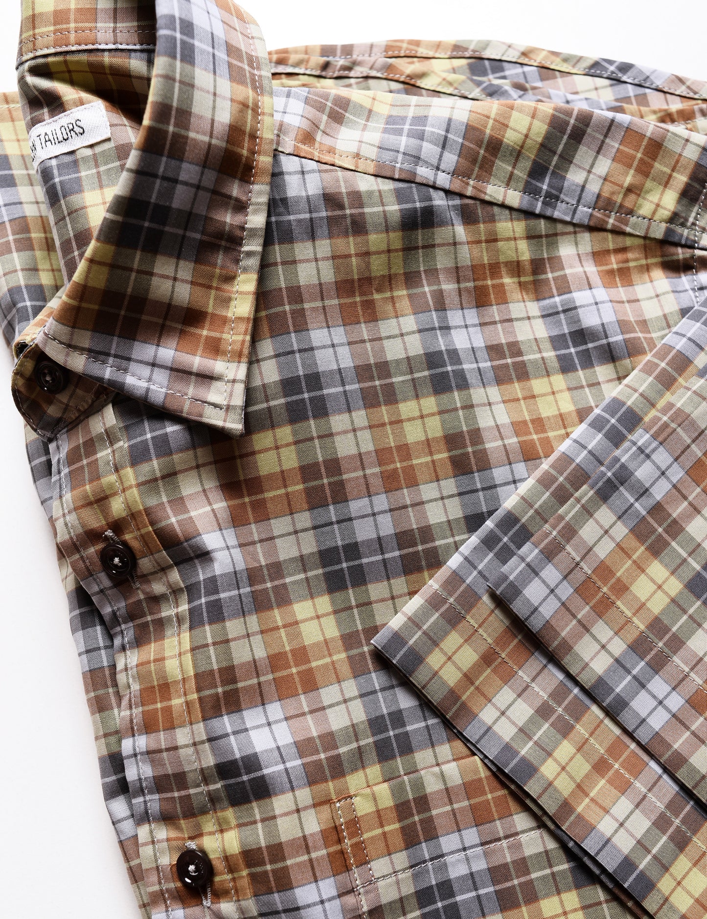 Detail shot of sleeve, collar, and buttons of Brooklyn Tailors BKT14 Casual Shirt in '70s Check - Sepia Tone