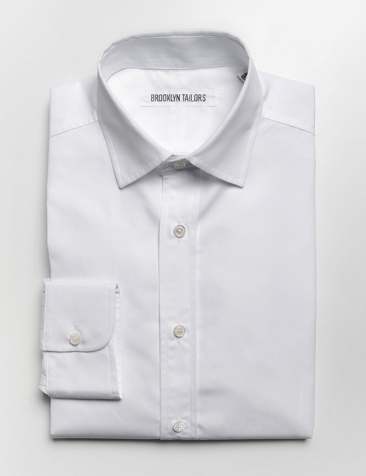 Brooklyn Tailors BKT20 Slim Dress Shirt in Crisp Poplin - White folded flat shot