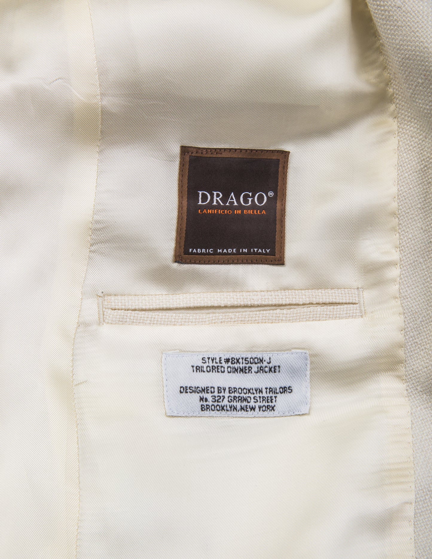 Detail shot of Brooklyn Tailors BKT50 Shawl Collar Dinner Jacket in Silk & Wool Hopsack - Ivory showing Drago label on interior of jacket