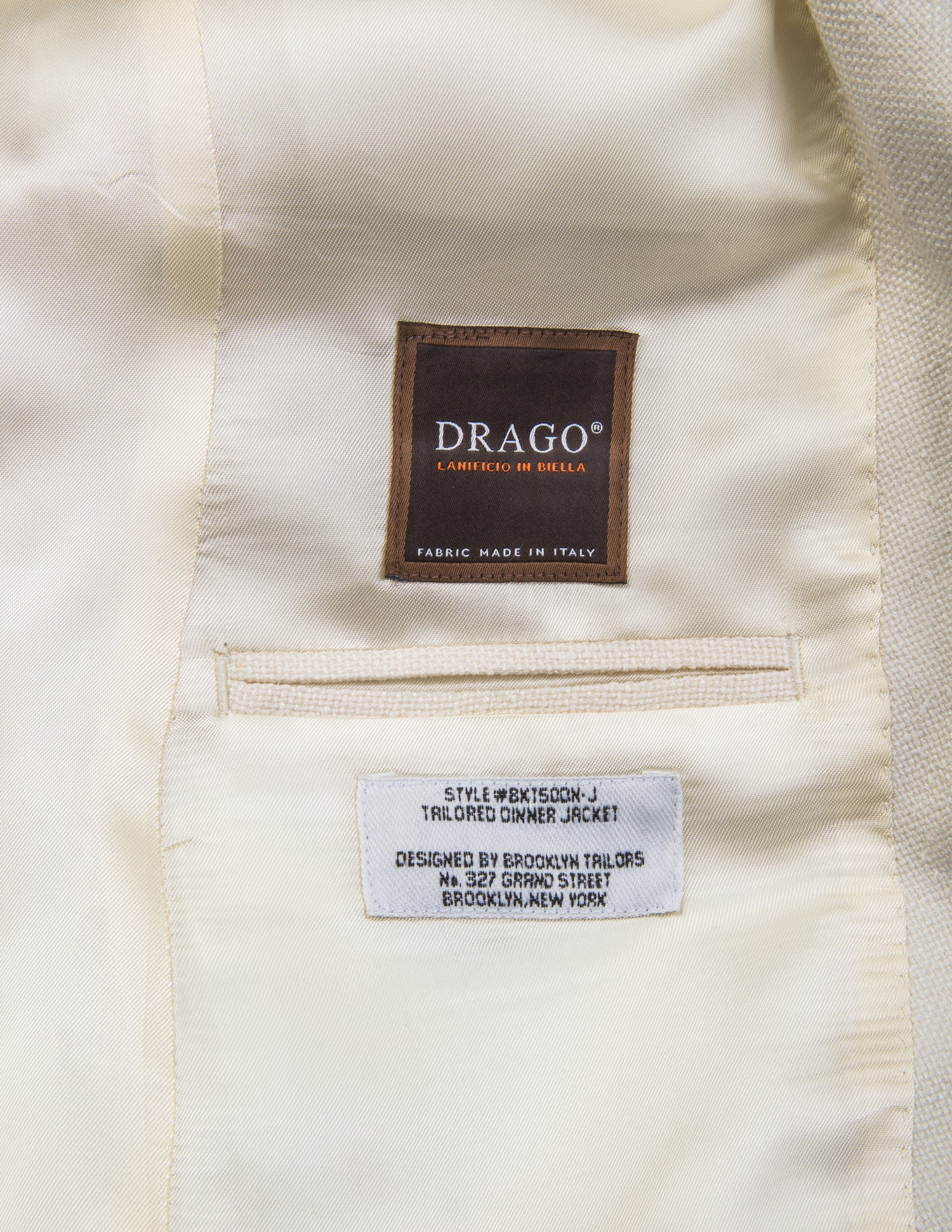 Detail shot of Brooklyn Tailors BKT50 Shawl Collar Dinner Jacket in Silk & Wool Hopsack - Ivory showing Drago label on interior of jacket