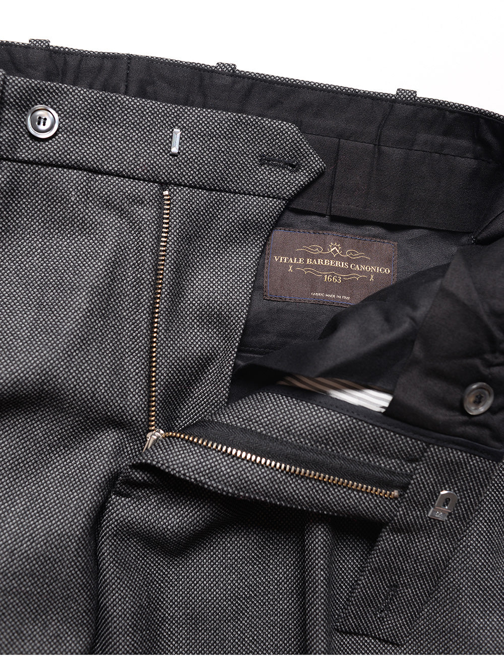 Detail shot of Brooklyn Tailors BKT50 Tailored Trousers in Birdseye Weave - Storm Gray showing zipper, interior lining, and waistband