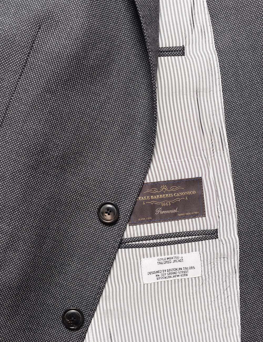 Detail shot of Brooklyn Tailors BKT50 Tailored Jacket in Birdseye Weave - Storm Gray showing buttons, lining, and interior labels