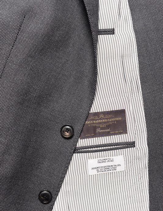 Detail shot of Brooklyn Tailors BKT50 Tailored Jacket in Birdseye Weave - Storm Gray showing buttons, lining, and interior labels
