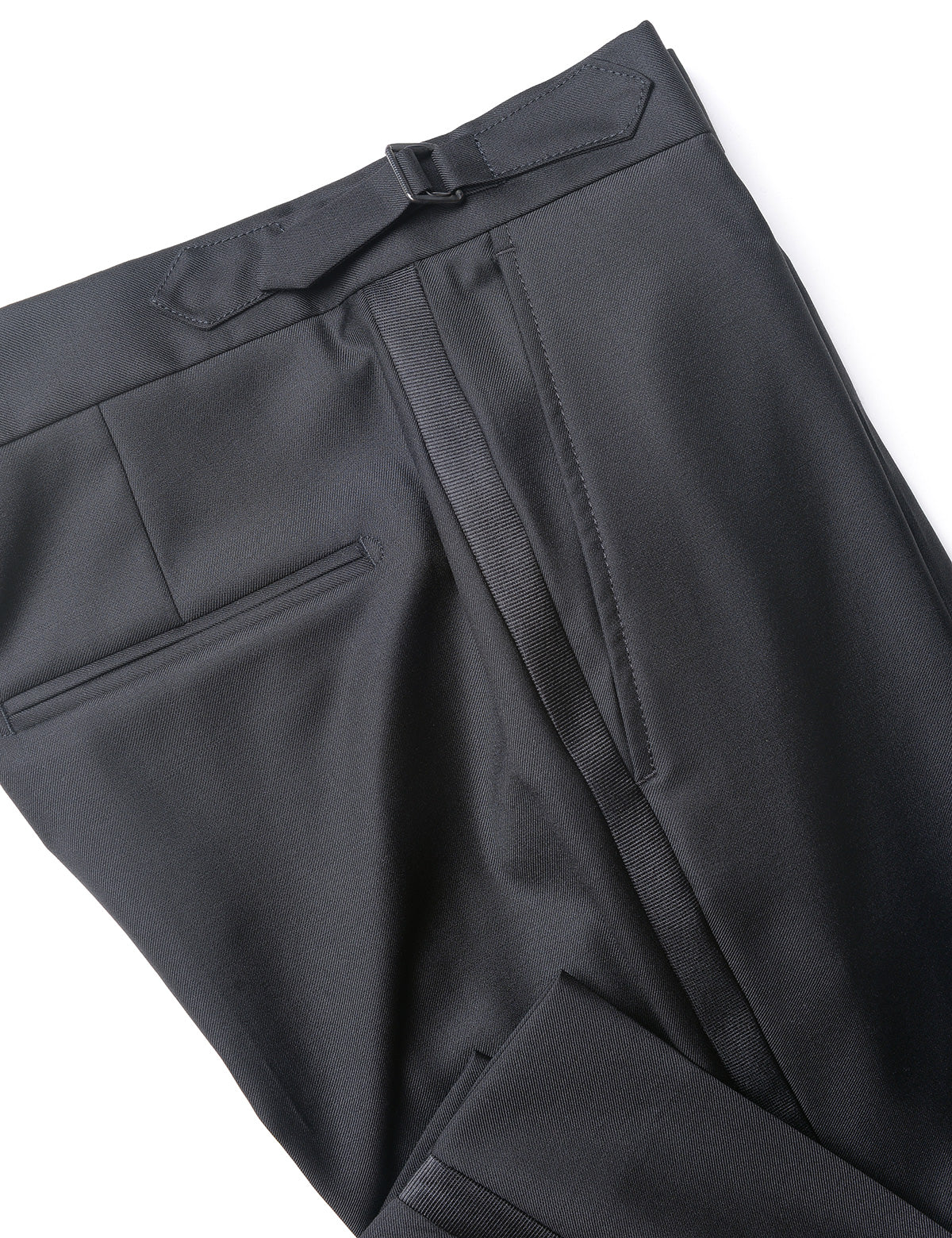 Detail shot of Brooklyn Tailors BKT50 Tuxedo Trouser in Super 120s Twill - Black with Grosgrain Stripe showing grosgrain stripe, side adjuster, back pocket, and hem