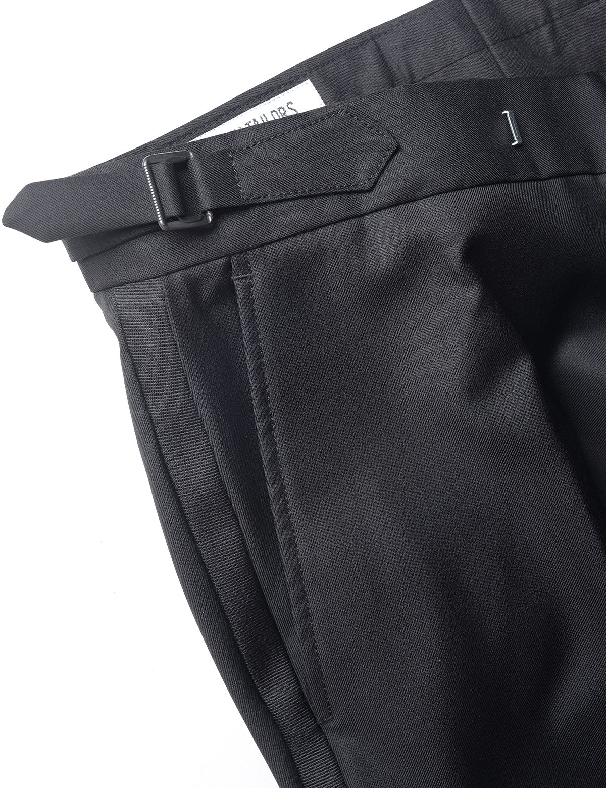 Detail shot of BKT50 Tuxedo Trouser in Super 120s Twill - Black with Grosgrain Stripe showing side adjuster and grosgrain stripe