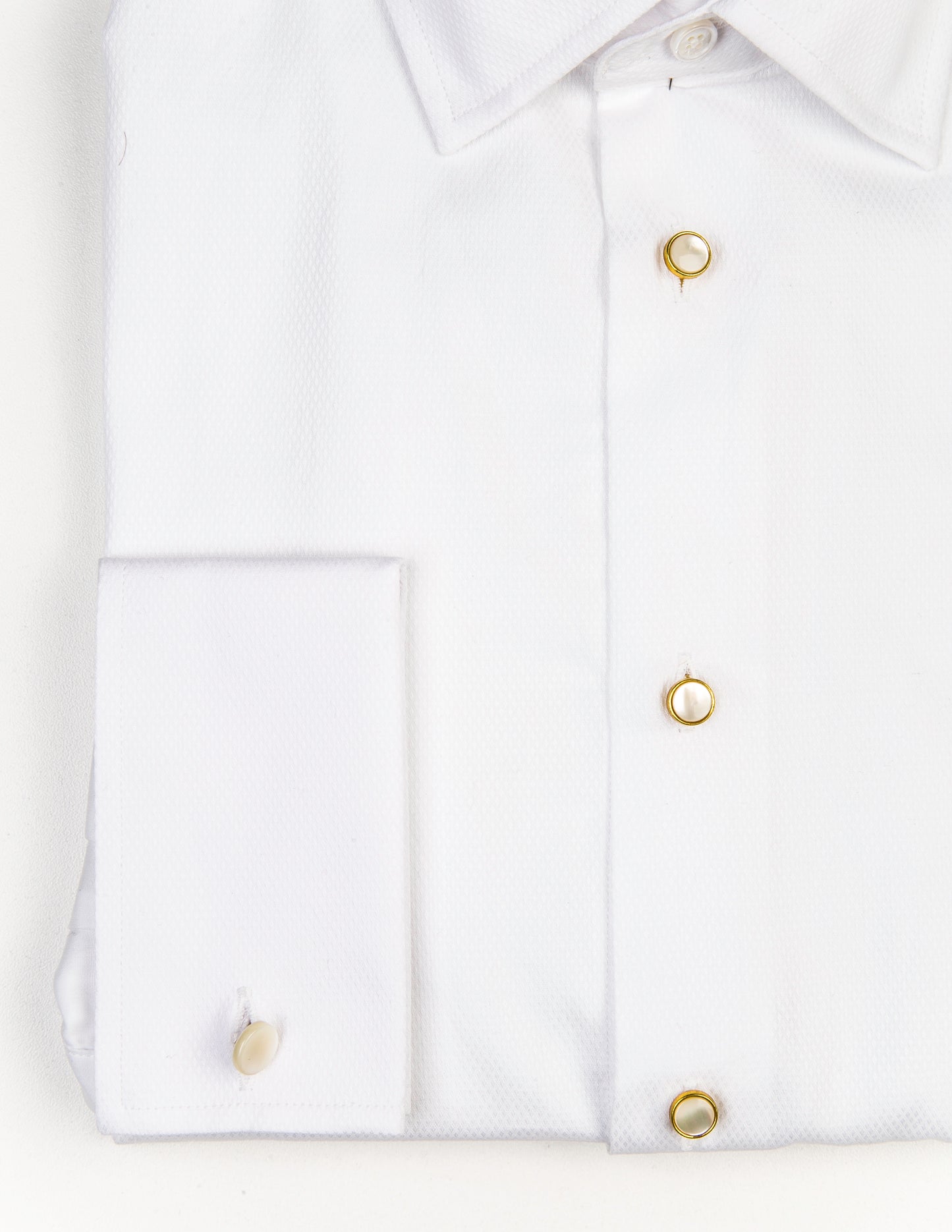 Detail of Mother of Pearl & Brass Dress Studs in a tuxedo shirt