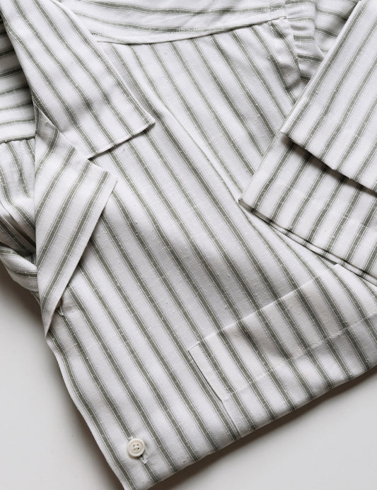 Detail of BKT18 Camp Shirt in Desert Stripe - Saguaro showing camp collar, sleeve, and fabric pattern