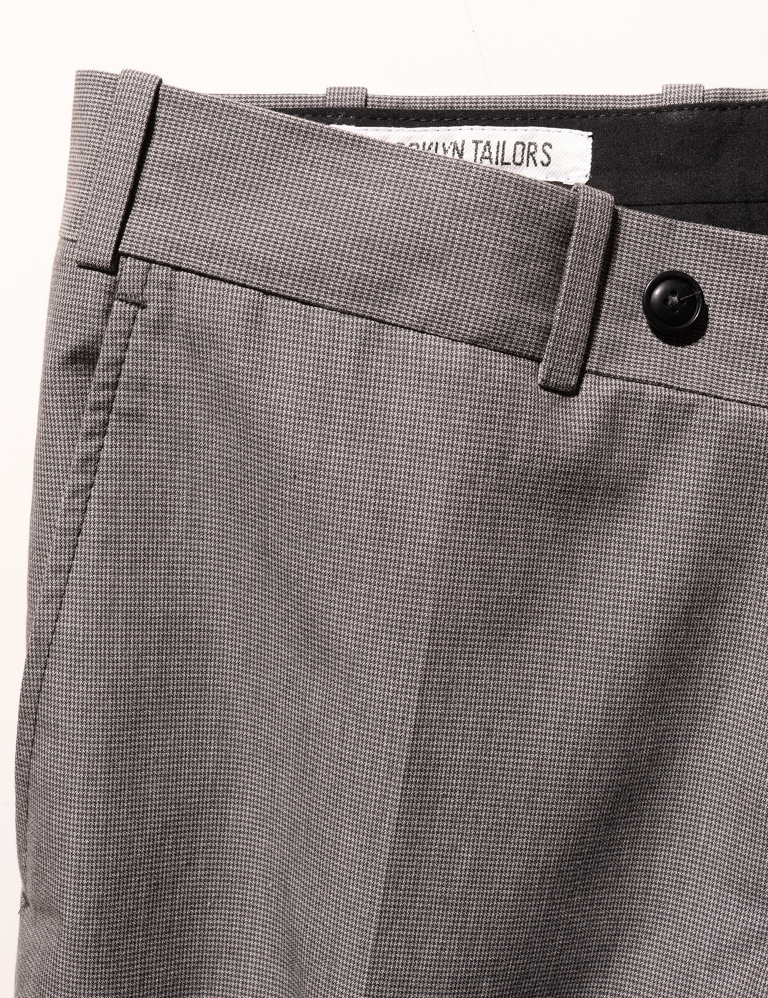 Detail of BKT50 Tailored Trousers in Cotton Micro Weave - Graphite showing waistband and fabric pattern