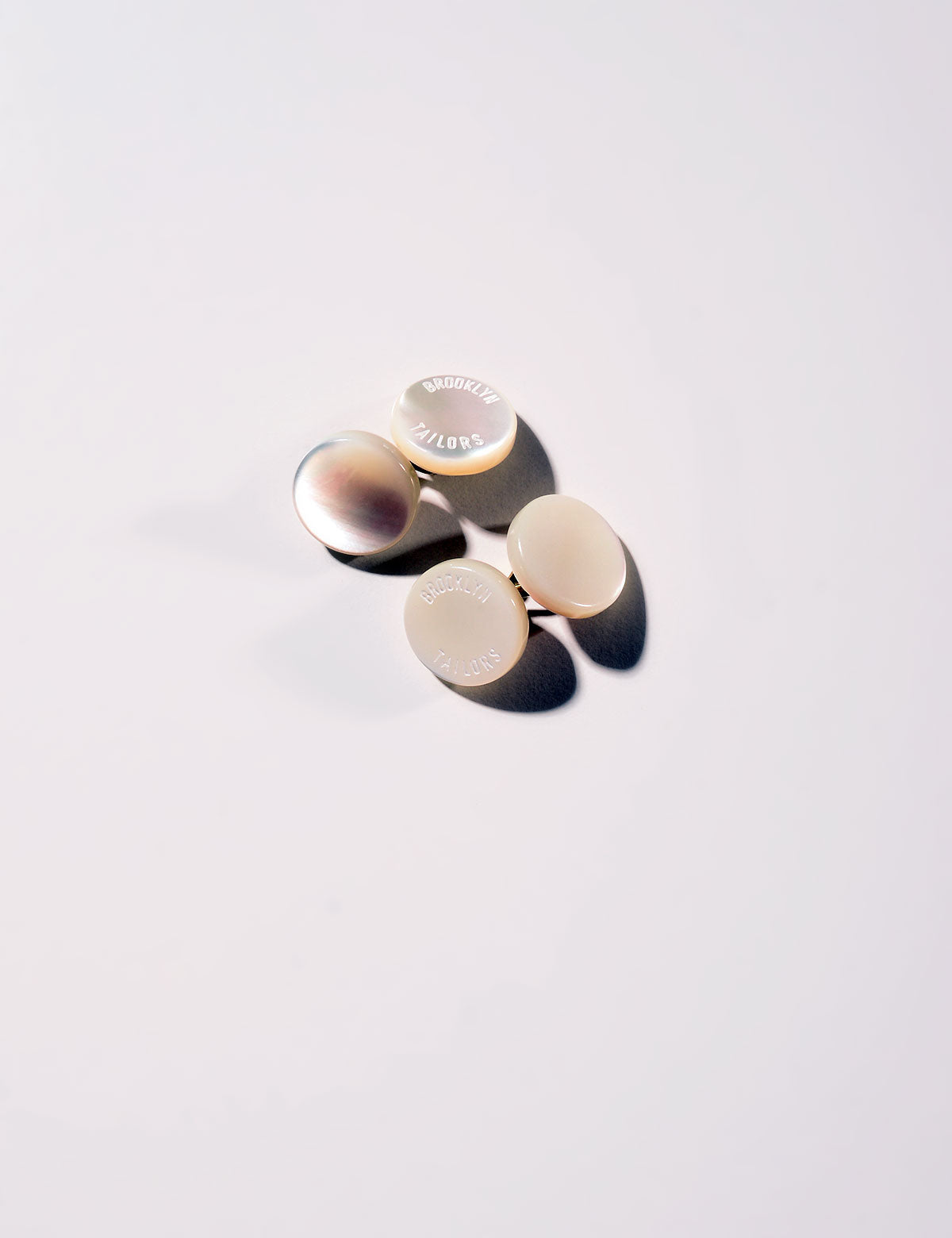 Flat shot of Brooklyn Tailors Genuine Shell Cufflinks - Ivory