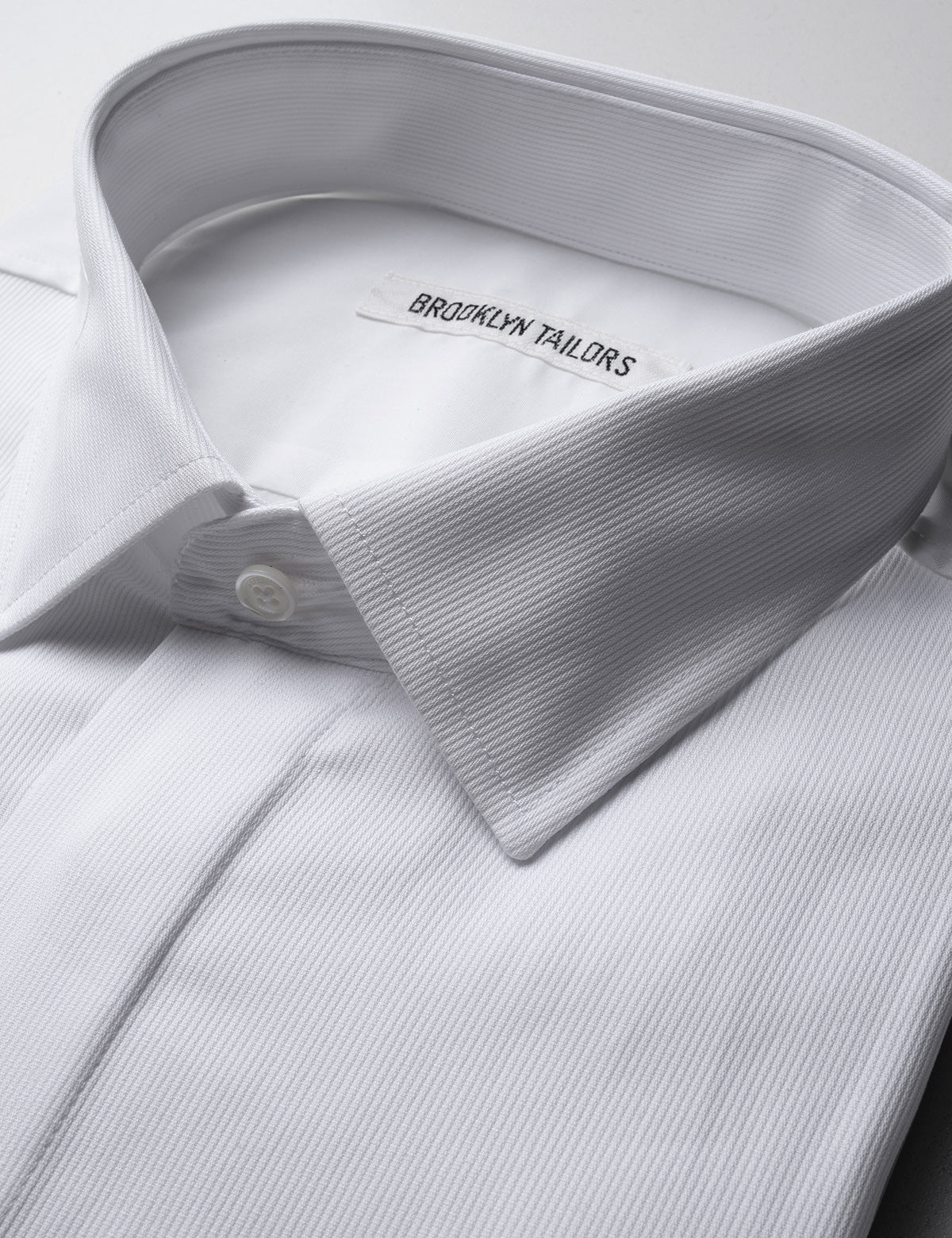 Detail of Brooklyn Tailors French Cuff Tuxedo Shirt With Covered Buttons - Bar Pique showing collar and covered placket