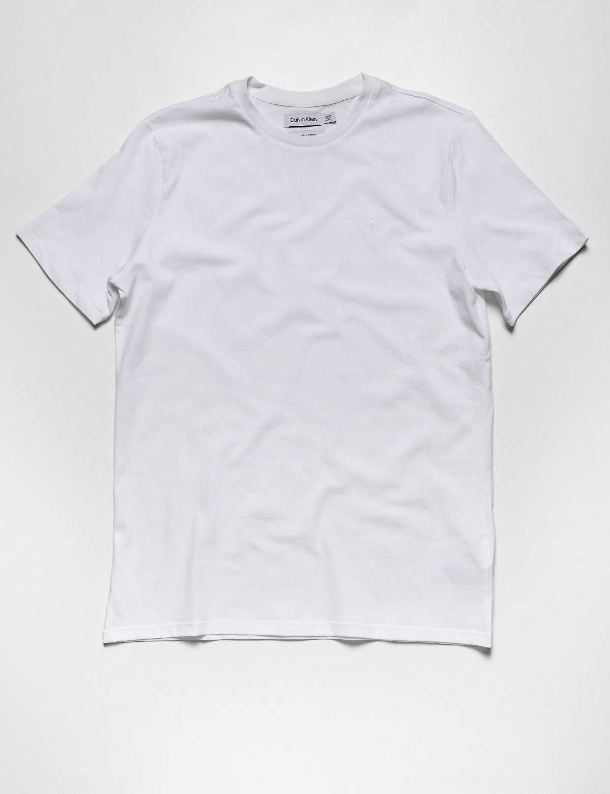 Full length flat shot of Calvin Klein Short Sleeve Smooth Cotton Solid Crewneck Tee - Brilliant White