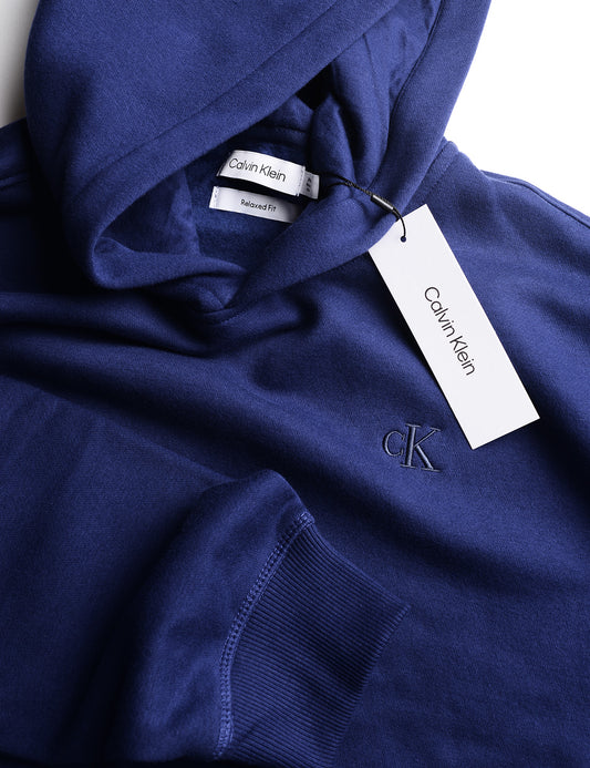 Detail of hood and chest embroidery of Calvin Klein Archive Logo Fleece Hoodie - Beacon Blue