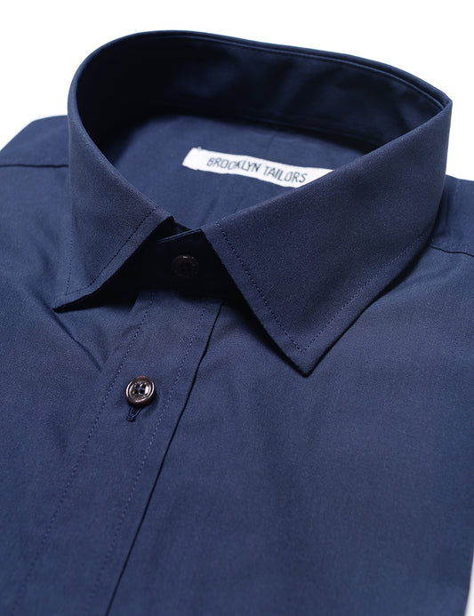 Detail shot showing collar, buttons, and fabric texture on Brooklyn Tailors BKT20 Slim Dress Shirt in Crisp Poplin - Rich Navy