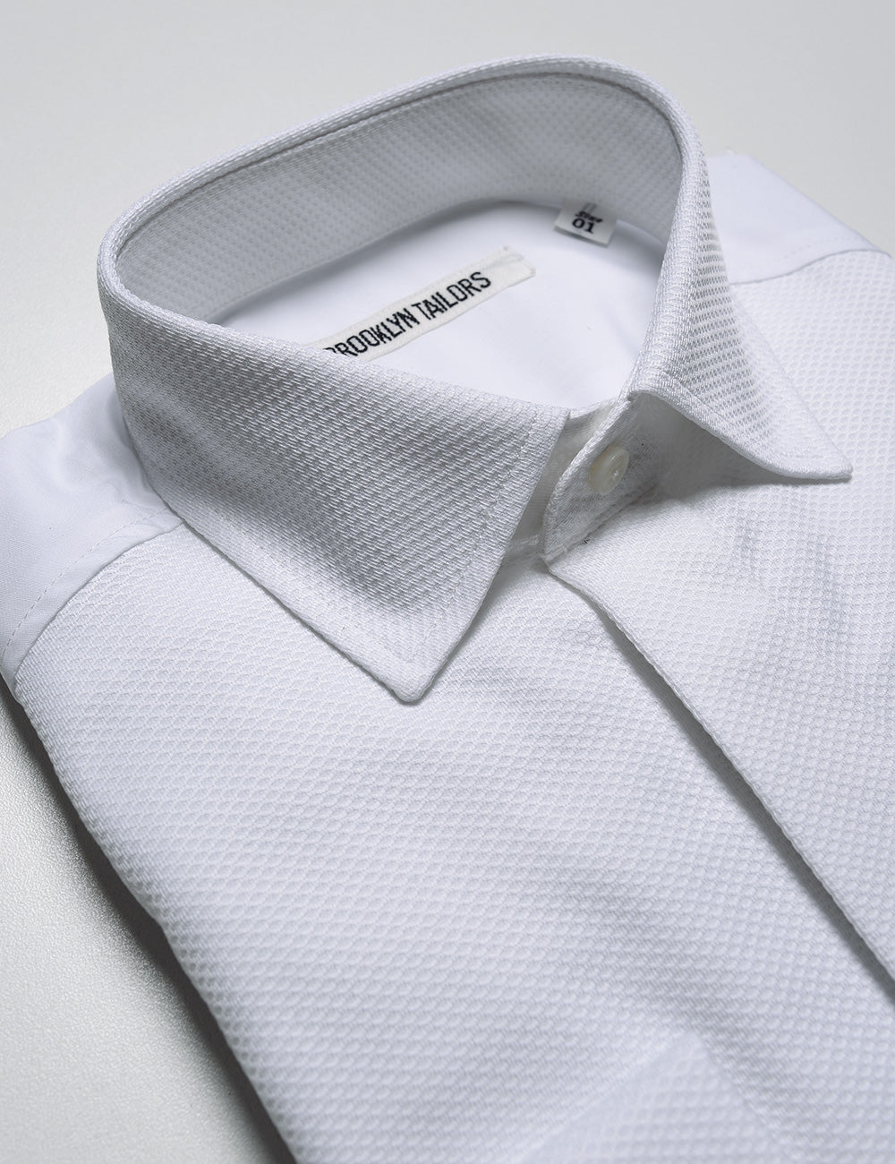 Detail shot of collar and placket on Brooklyn Tailors BKT20 Classic French Cuff Tuxedo Shirt - Waffle Pique