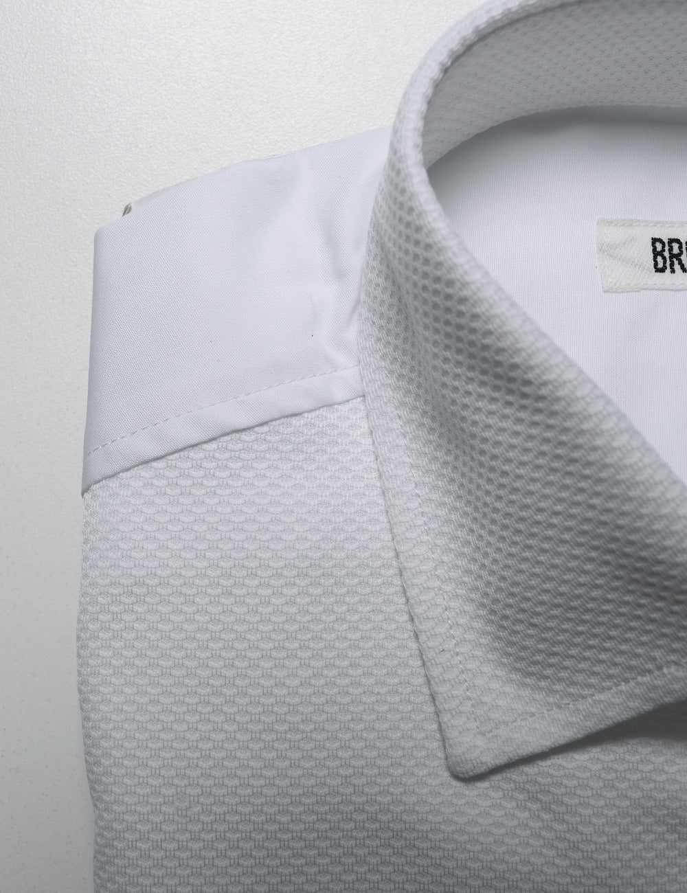 Detail shot showing the collar, and fabric detail and how the back fabric is different on Brooklyn Tailors BKT20 Classic French Cuff Tuxedo Shirt - Waffle Pique