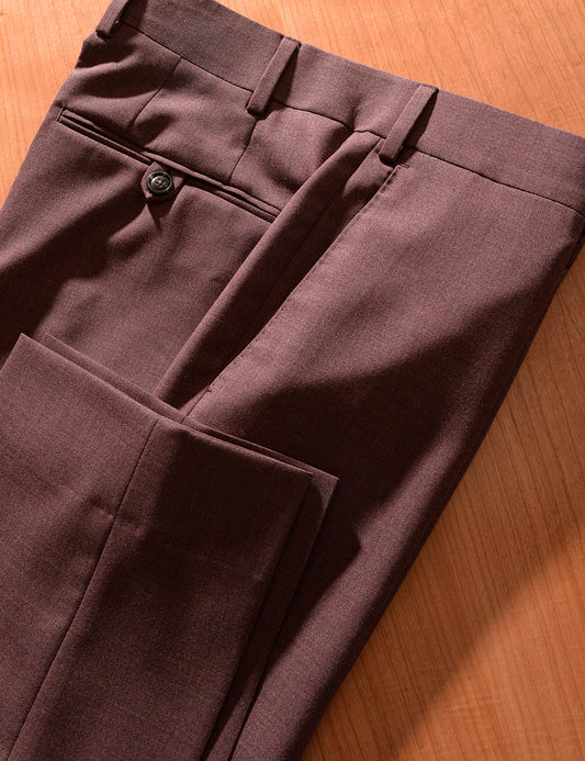 Detail shot of Brooklyn Tailors BKT50 Tailored Trousers in 14.5 Micron Mouliné - Cordovan showing hem, side pocket, back pocket and waistband