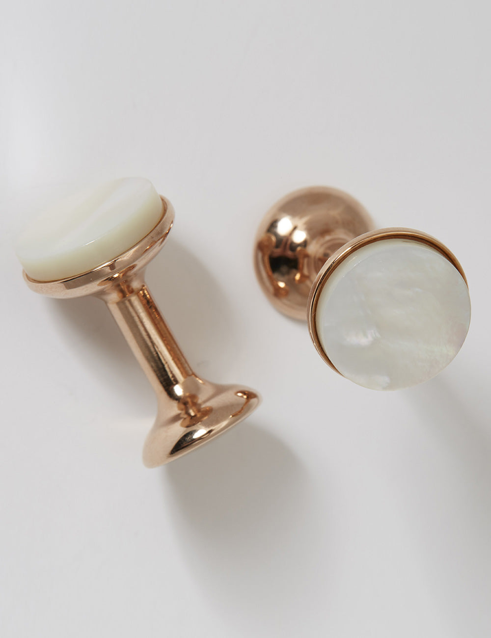 Main shot of Codis Maya Stone Bow Cufflinks in 18 Carat Rose Gold & Mother of Pearl