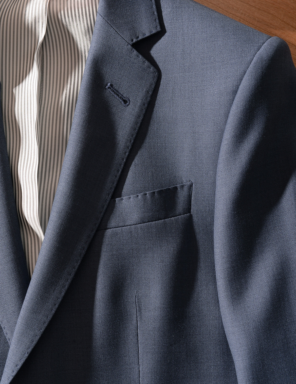 Detail shot of Brooklyn Tailors BKT50 Tailored Jacket in Wool Sharkskin - Haze Blue showing lapel and chest pocket