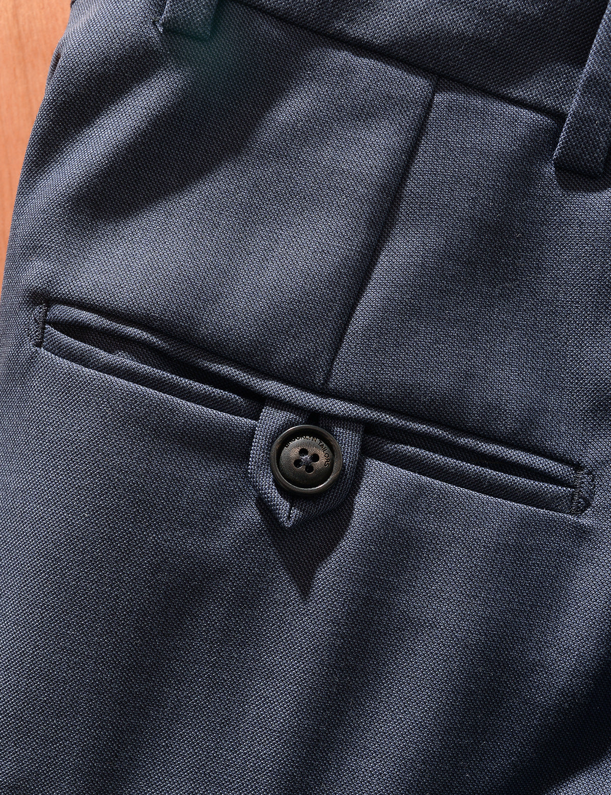 Close up of BKT50 Tailored Trousers in Wool Sharkskin - Haze Blue showing back pocket