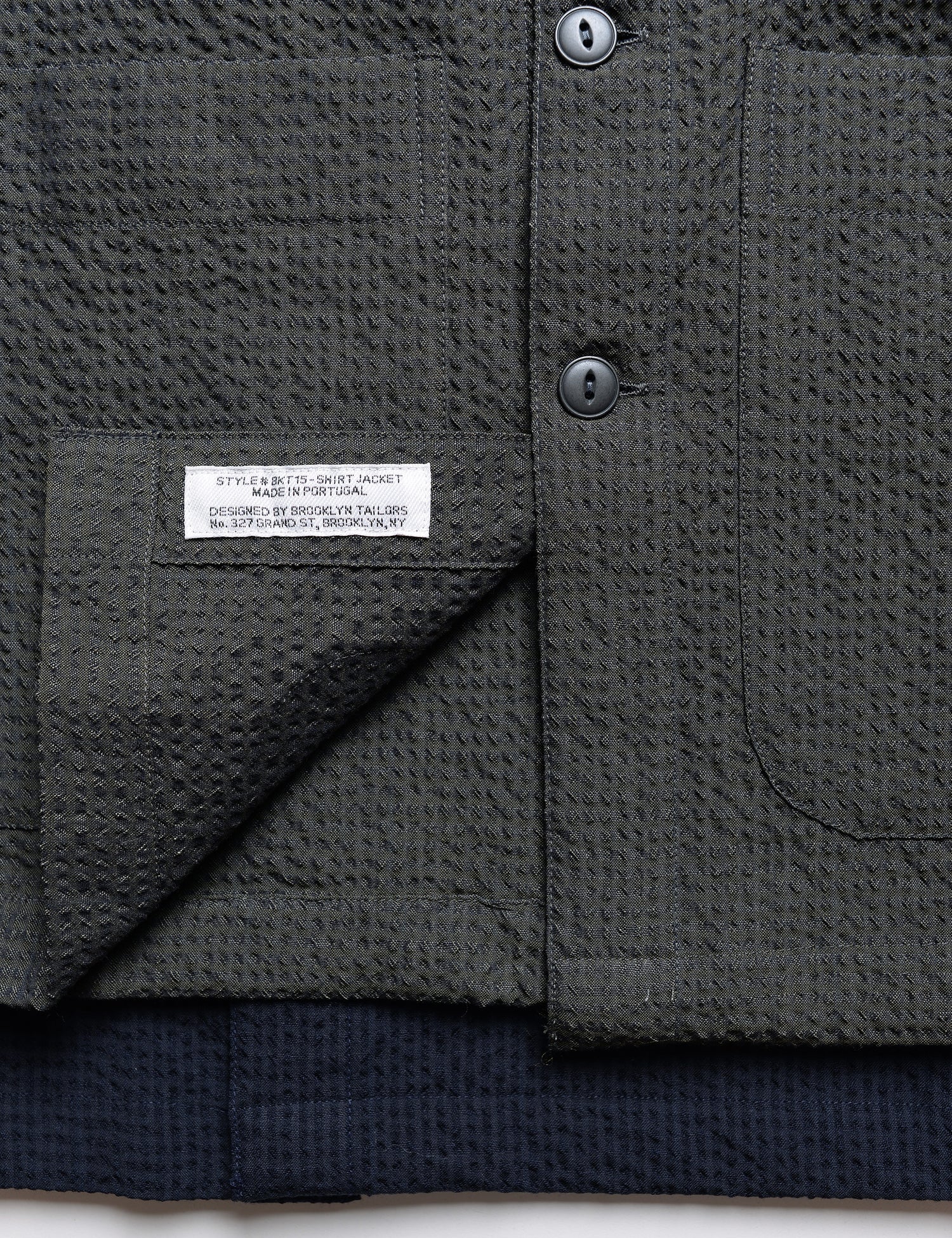 Detail shot of hem and interior labeling for Brooklyn Tailors BKT15 Shirt Jacket in Crinkled Wool & Cotton - Storm
