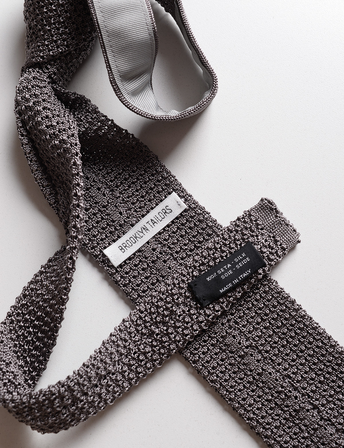 Detail of labels and knit of Italian Silk Knit Tie - Steel