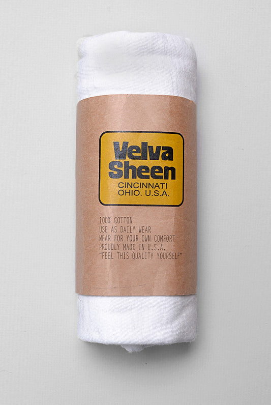 Photo of Velva Sheen Crewneck T-Shirt in Vintage White rolled in its paper packaging