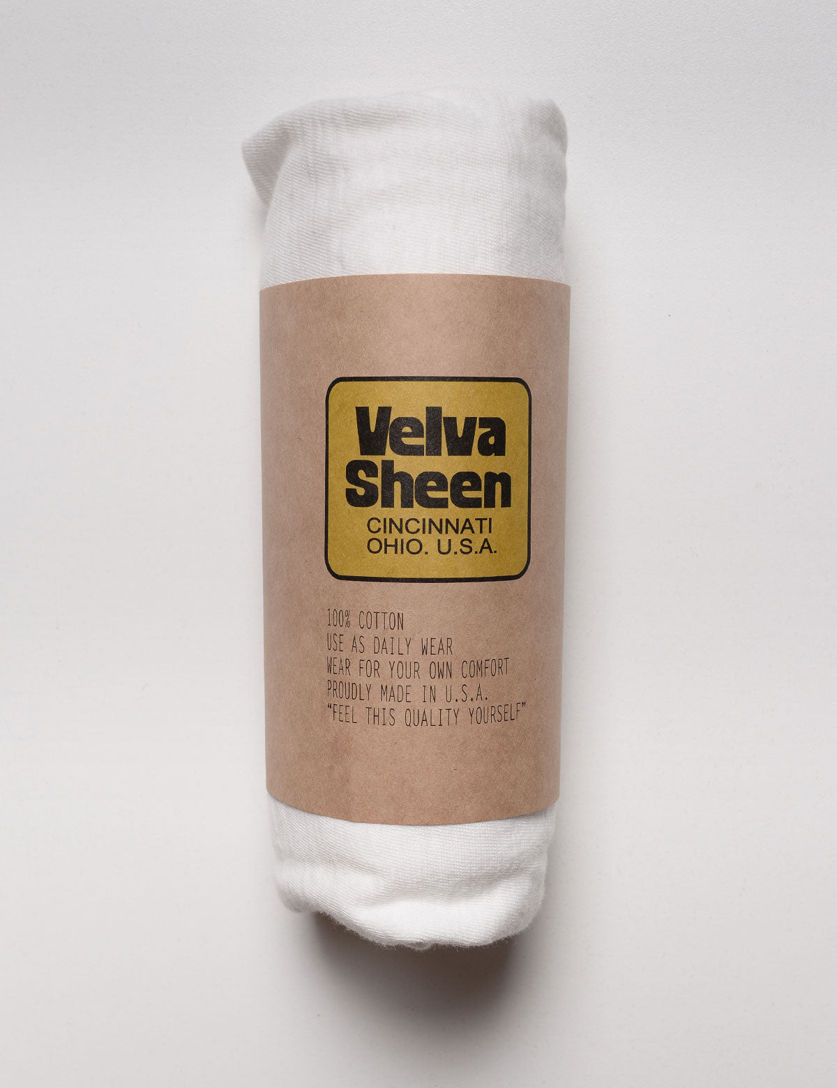 Velva Sheen Long Sleeve Crewneck T-Shirt in White rolled in paper sleeve