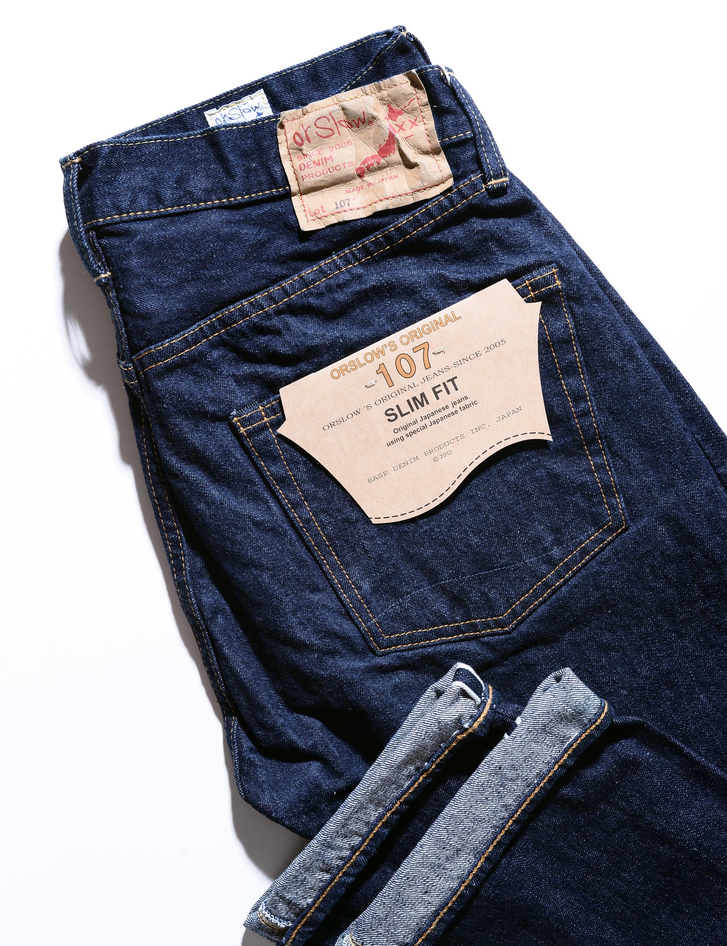 Back pocket and labeling detail shot of 107 Slim Fit Selvedge Denim Jeans - One Wash