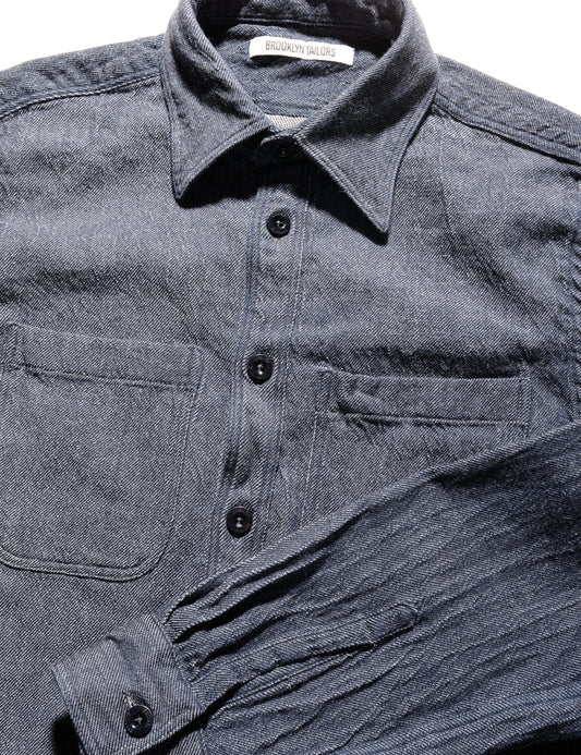 Detail shot of BKT16 Overshirt in American Denim - Indigo showing collar, buttons, and fabric