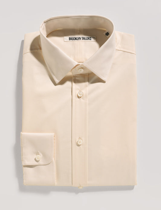 Folded flat shot of Brooklyn Tailors BKT20 Slim Dress Shirt in Supima Cotton Twill - Ivory