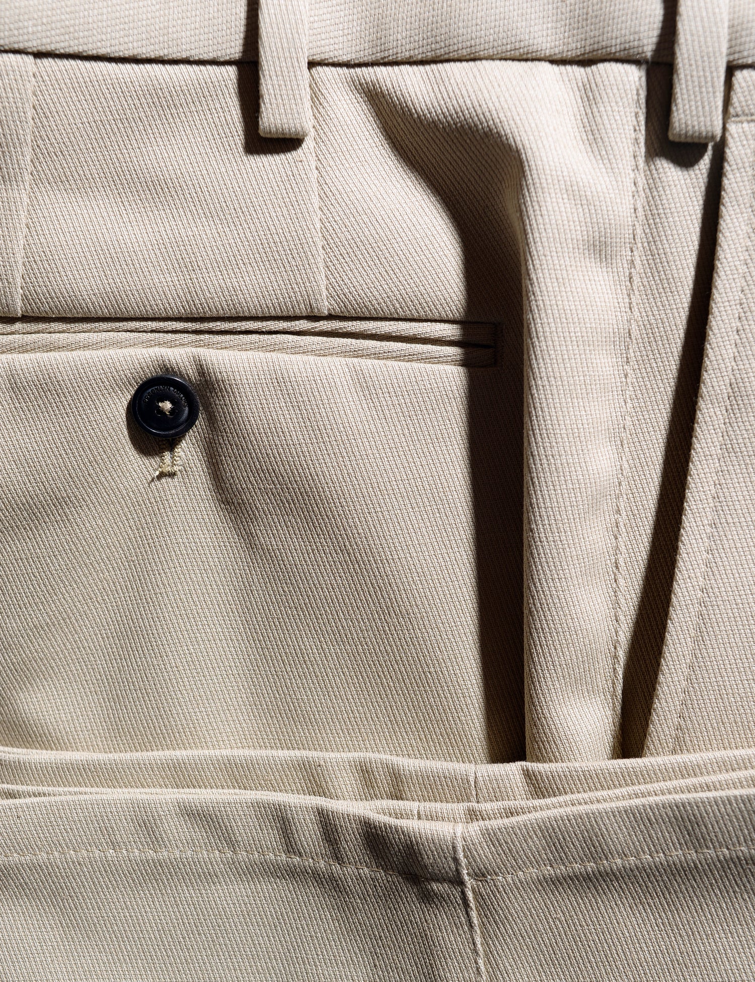 Detail shot of back pocket, waistband, and hem of Brooklyn Tailors BKT36 Straight Leg Pant in Cotton Cavalry Twill - Sand