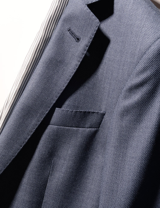 Detail shot of Brooklyn Tailors BKT50 Tailored Jacket in Birdseye Weave - Steel Blue showing lapel, lining, and pocket