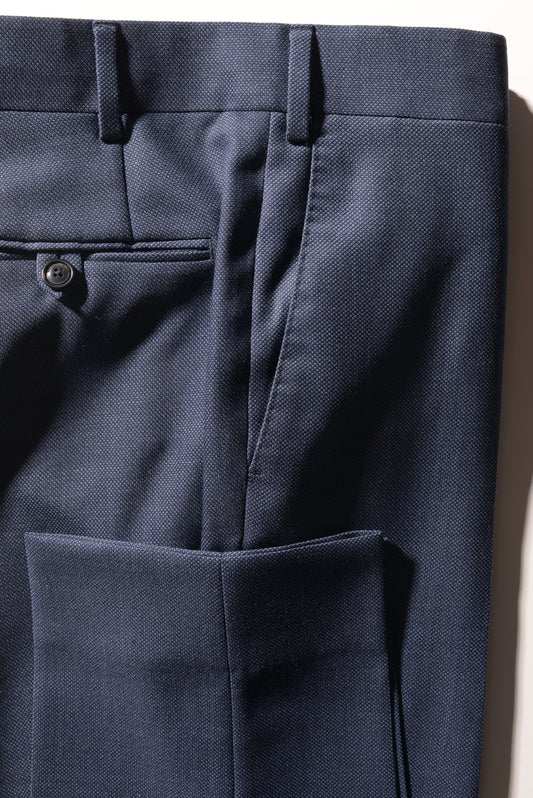 Detail shot of Brooklyn Tailors BKT50 Tailored Trousers in Birdseye Weave - Heather Blue showing hem, back pocket, and side pocket