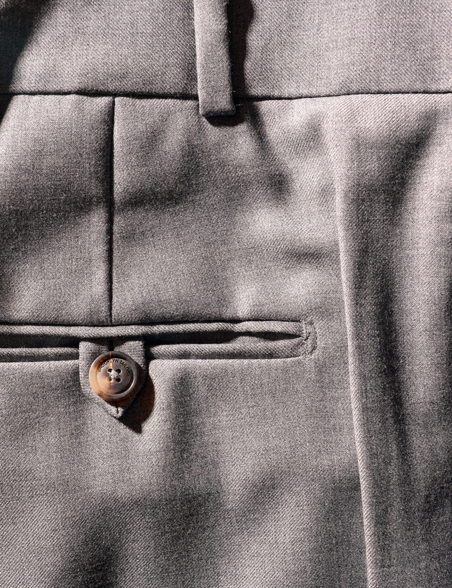 Detail shot of Brooklyn Tailors BKT50 Tailored Trouser in Super 110s Twill - Dove Gray showing back pocket and waistband